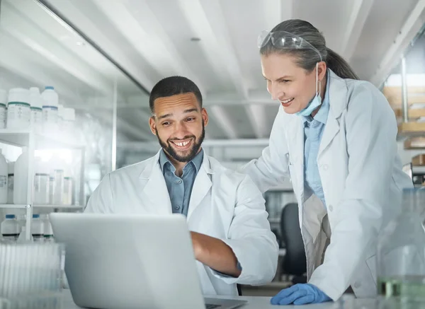 Science, teamwork and doctor working with laptop, tech or computer for innovation, insurance or research in hospital lab. Medicine, internet and happy scientist search for future DNA data analysis.