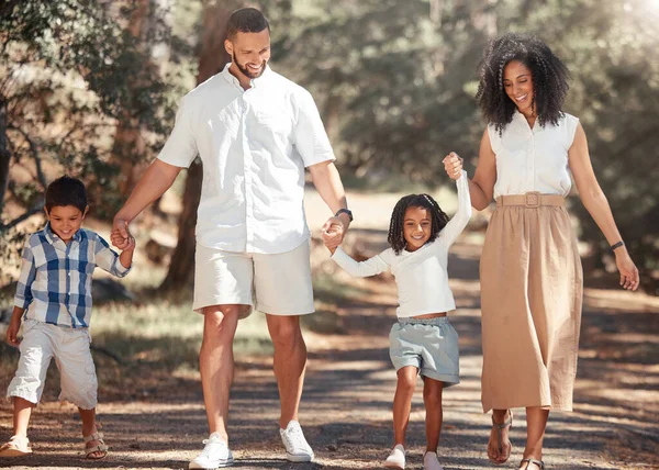 Family, love and kids walking with parents in park, happy and relax in nature together. Freedom, active and peaceful cardio with excited children enjoy freedom with mother and father, playful fun.