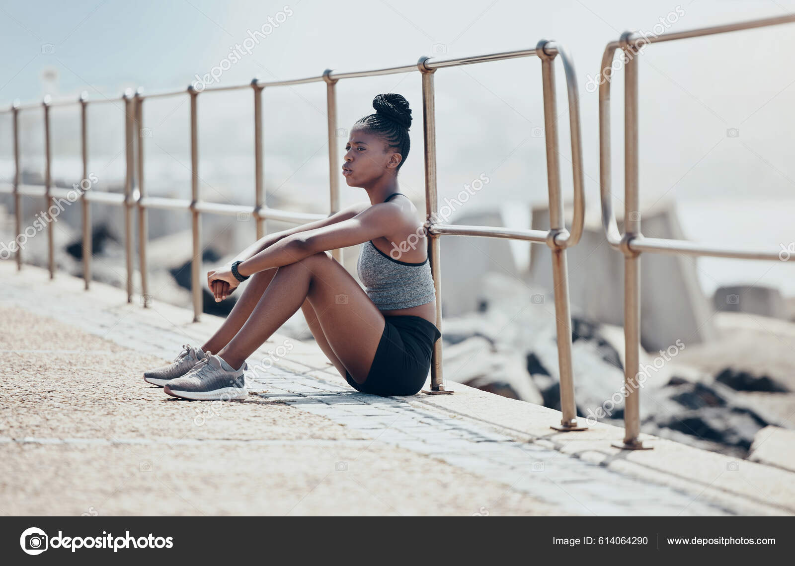 crossfit african woman sitting at gym, resting, taking a break