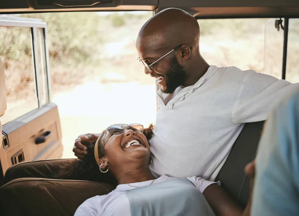 Road trip, black couple and travel during drive through nature on a summer vacation with a smile, happiness and love. Happy man and woman laughing and bonding on safari journey or trip together.