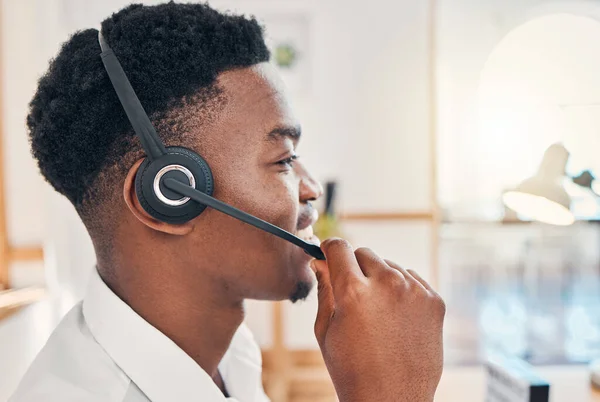 Call center, business and black man consulting, giving support and help to people online at work. Face of an African customer service employee working as a consultant for a telemarketing company.