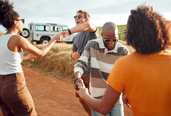 Road trip, travel and friends dancing together celebration for holiday journey, outdoor vacation and adventure lifestyle with car. Happy diversity couple dance by countryside road in summer with love.