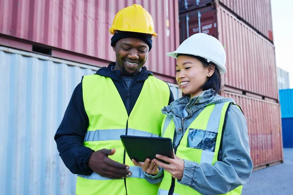 Logistics, cargo and diversity team with tablet check world, global or international tech data of shipping, delivery or stock. Container, collaboration and supply chain industry man and woman working.
