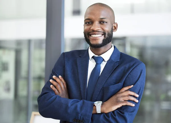 Leadership, management and arms crossed with businessman in office for executive, success and vision. Smile, innovation and goals with professional black man employee working in corporate company.