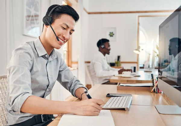 Telemarketing employee, customer service consulting and writing notes in notebook for CRM contact us notifications. Office call center, consultant gives service and advice with a smile to clients faq.