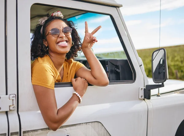 Car, road trip and girl with sign of peace, crazy high energy and on fun transportation adventure in Australia countryside. Hands, travel journey and black woman happy and excited on safari excursion.