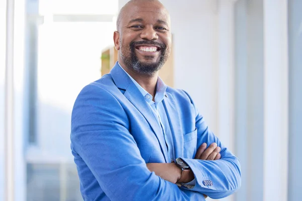 Happy, success and portrait of black man startup ceo, proud, confident and leader African business. Vision, future and businessman in Africa with leadership in corporate company with smile in office.