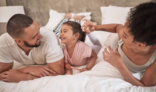 Happy, black family and bed time of parents and a child with a smile in a home bedroom together. Mother, man and young kid laughing and bonding with happiness and fun in a house at night or morning.