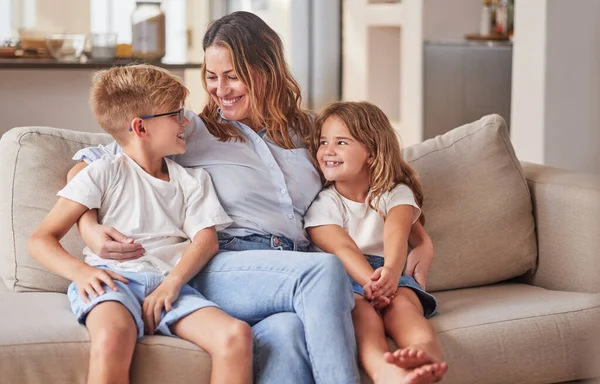 Happy kids, mom and mothers day in living room sofa, love and relaxing together in Australia family home. Young children, smile parent and happiness, quality time and care on lounge couch for fun.