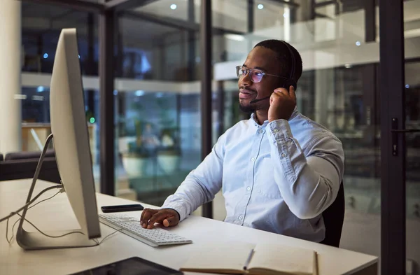 Call center, CRM or customer service working black man with telemarketing or customer support in office. Consultant, contact us or help desk agent consulting, support or advice with questions.