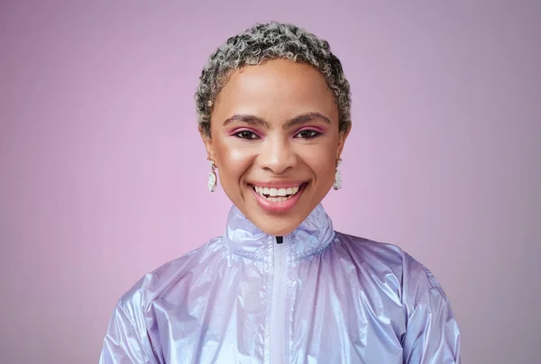Black woman, fashion and smile with holographic purple studio background with a happy, cosmetics and makeup for retro style. Face beauty portrait of an African female looking trendy with vaporwave.