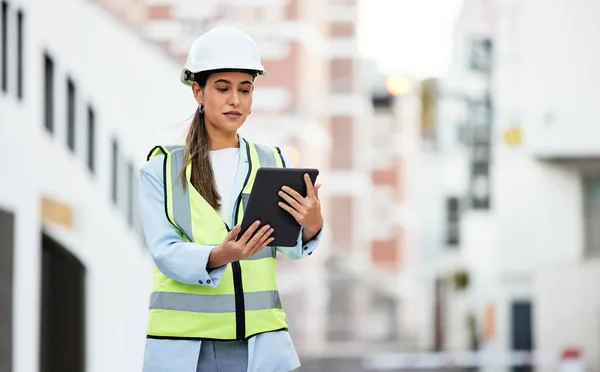 City, digital tablet and woman construction worker with software app for management, site planning and building progress check. Engineer manager in safety gear and 5g technology for urban development.