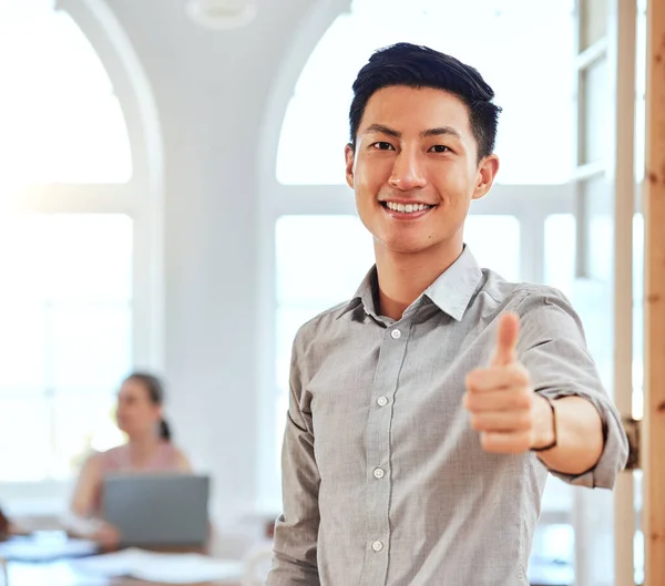 Thumbs up, asian businessman portrait and manager success, support and trust in modern office. Happy leader celebrate winner, motivation and thank you feedback for goal, like emoji and yes vote hands.