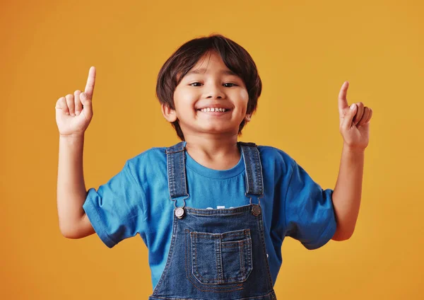 Adorable Little Boy Looking Cheerful Wearing Casual Clothes Pointing His — ストック写真