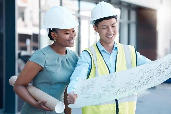 Architecture, construction engineers or designers with blueprint paper talking or planning office building design. Smile, happy and property teamwork collaboration with real estate innovation vision.