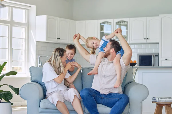 Family Four Sitting Sofa Smiling Caucasian Family Bonding Laughing Talking — Stock Photo, Image