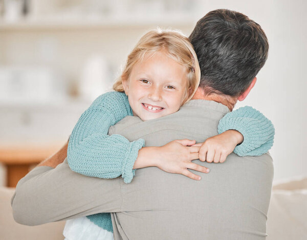 Hes the best dad in the whole world. Cropped portrait of an adorable little girl embracing her mom lovingly at home