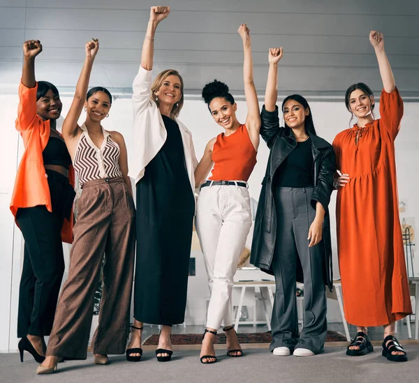 We stand together as women. a group of businesswoman standing in an office at work