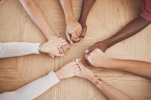 Holding hands, faith and prayer support group of people or friends with hope, religion and trust or respect. Together, helping and love community with commitment, solidarity and teamwork from above.