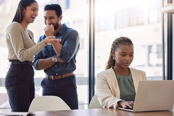 Surround yourself with people who support you. two businesspeople gossiping about a coworker at work