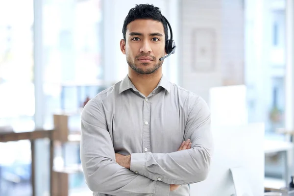 Ill do my best to make it better for you. Portrait of a young businessman using a headset in a modern office