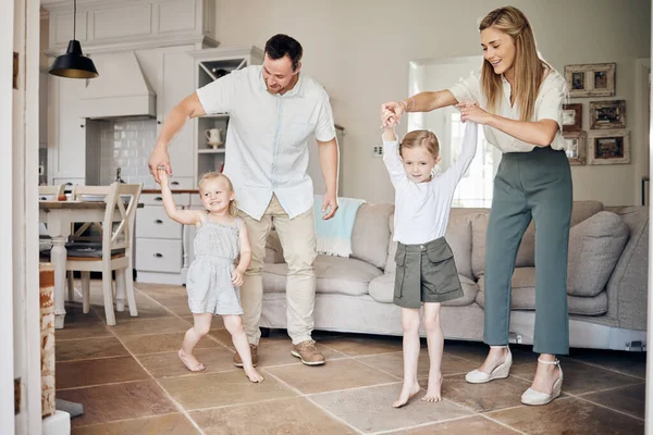 My favorite love story is ours. a young family dancing at home