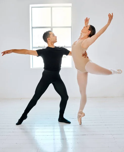 Dance like your life depends on it. Full length shot of two young ballet students rehearsing in their dance studio