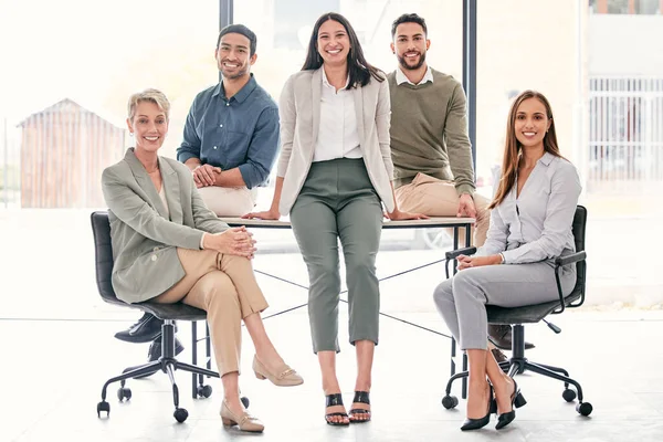 Were the best people for the job. Full length shot of a diverse group of businesspeople sitting together in the office during the day