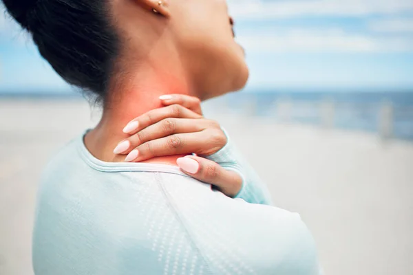 Fitness, sports and injury, woman with neck pain on outdoor workout closeup. Workout pain, girl with hand on neck and swollen red shoulder muscle for massage, physical therapy or medical attention