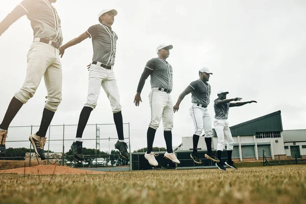 Baseball, training and exercise with a sport team preparing for a game on a grass pitch or field for sports. Fitness, teamwork and health with man friends getting ready during practice or a workout.