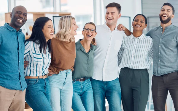 Teamwork, friends and funny with business people laughing together in their office at work. Collaboration, happy and success with a man and woman employee group joking while working as a team.