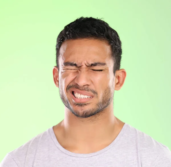 Handsome Young Man Making Face Green Background Studio — Stock Photo, Image