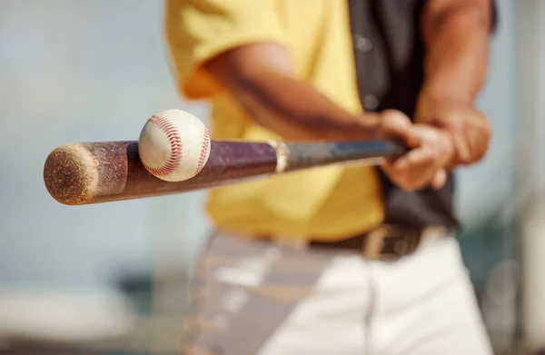 Baseball, bat and ball being hit on a field at a sports training, practice or competition game. Softball, sport equipment and man athlete practicing to swing a wood baton on outdoor pitch or stadium