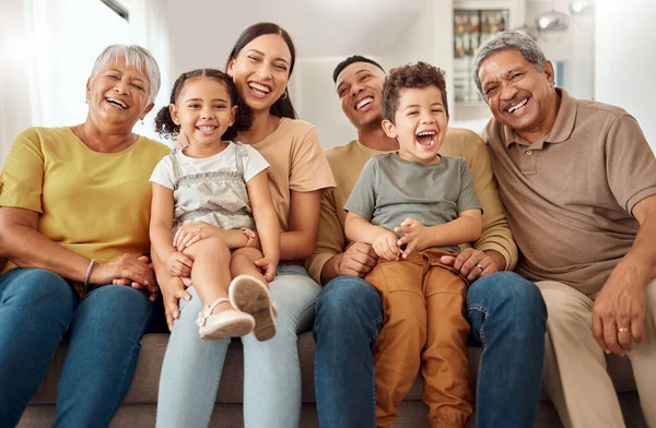 Happy, big family and portrait smile on sofa in happiness for relationship, quality bonding and time together at home. Parents, grandparents and kids smiling for relaxing family on living room couch.