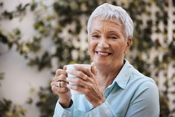If youre relaxed, youre doing it right. a senior woman having coffee in the garden at home