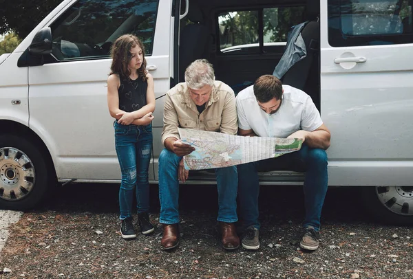 Travel, car and family with map for direction, transportation support and planning course journey on Canada road trip. Kid girl, grandpa, dad on auto SUV van, vacation and lost driver search for way.