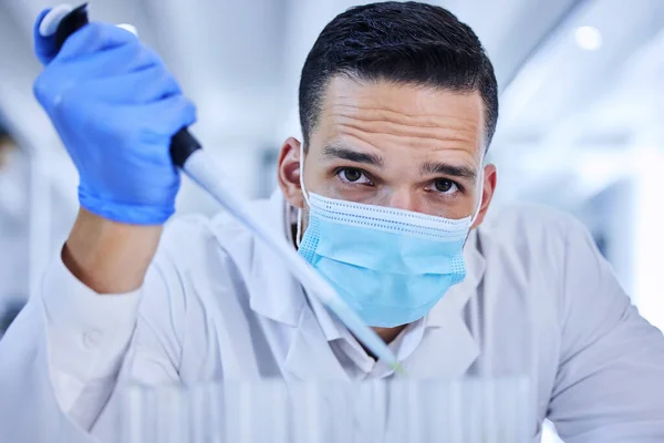 Testing chemical reactions. Cropped portrait of a handsome young male scientist working in his lab