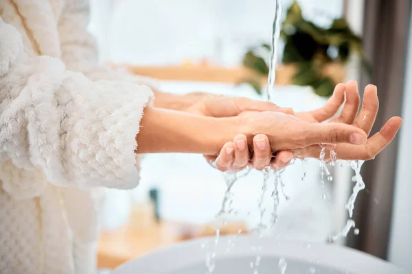 Theres nothing better than clean hands. a woman washing her hands in her bathroom