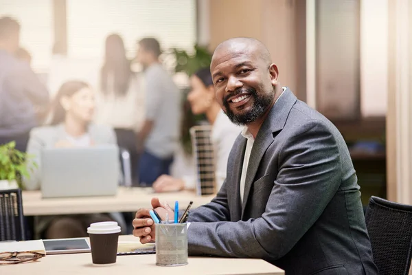 A strong leader makes a strong team. a businessman in his office