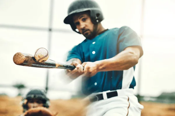 Sports, baseball and bat with a man athlete hit a fast ball and score during a game outdoor on a pitch. Sport, fitness and exercise with a strong male player on a field for training or a match.