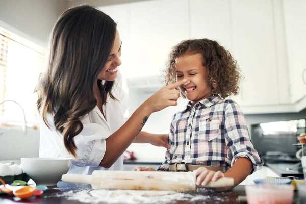 Basic life skills needs no gender. an adorable little girl baking with her mom at home