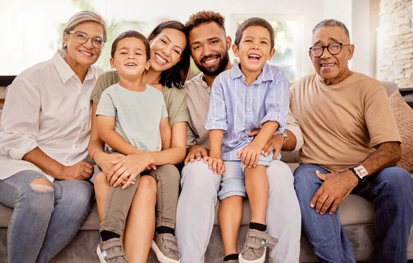 Big family, bonding and happy smile on a home living room sofa spending quality time together. Portrait of parents, elderly people and children with happiness smiling on a family home lounge couch.