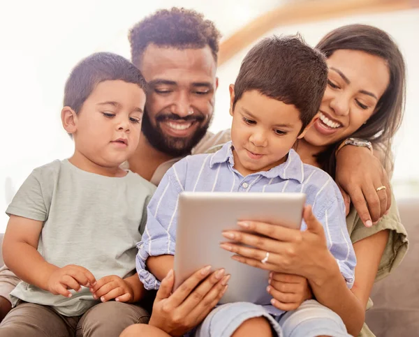 Family bonding, children and tablet kid game of parents and kids together on a education app. Happy people on digital games, internet and online video watching on a house sofa with technology.