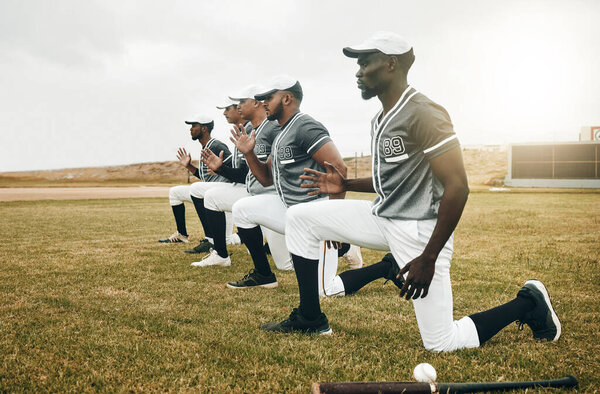 Baseball, sports and fitness with a team stretching on a grass pitch or field before a game outdoor. Exercise, training and workout with a male baseball player group getting ready for a sport match.