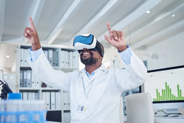 Science changes the way you see the world. a mature scientist using a virtual reality headset while working in a lab