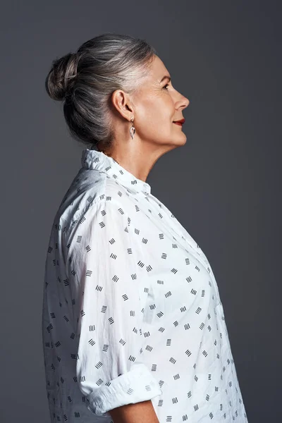 Theres more to me than just my age. Studio shot of a senior woman posing against a grey background