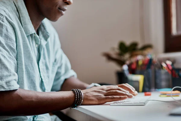 Getting down to getting it done. a businessman using a computer in a modern office