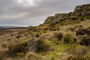 Baldstone, and Gib Torr looking towards the Roaches, Ramshaw Rocks, and Hen Cloud during winter in the Peak District National Park. clipart