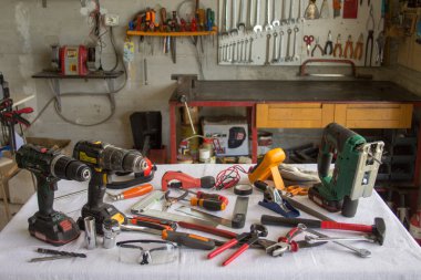 Image of a handyman's workshop and a bench with do-it-yourself work tools