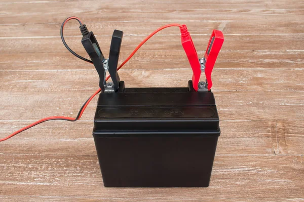 Image of a charging battery. Charging a lead acid battery for cars and motorcycles